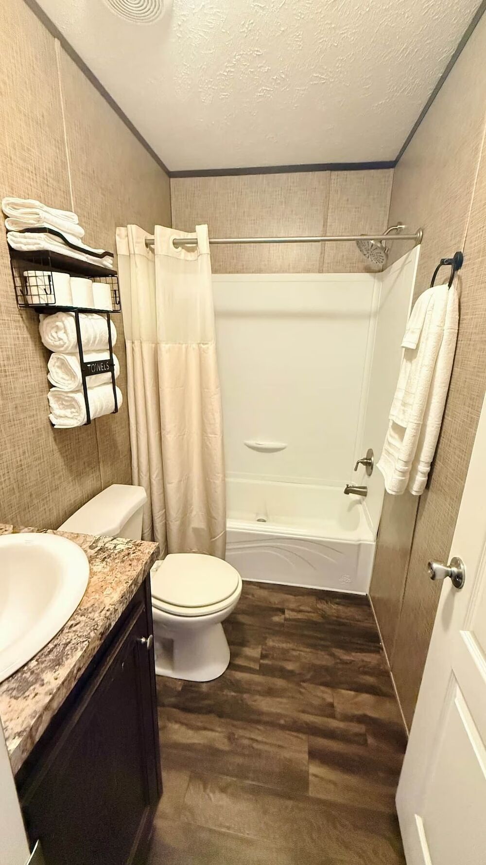 Full bathroom with shower-tub combo and vanity