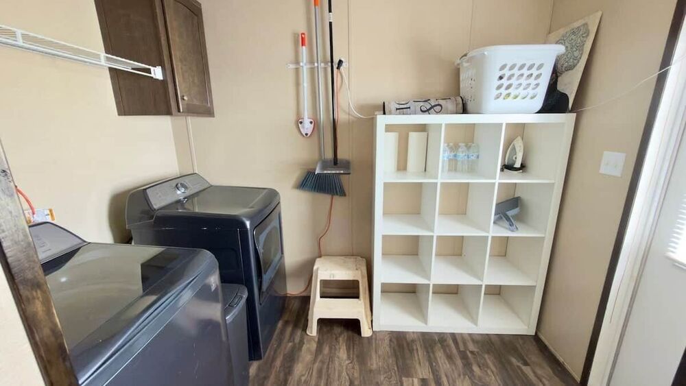 In-home laundry room with a full-size washer and dryer